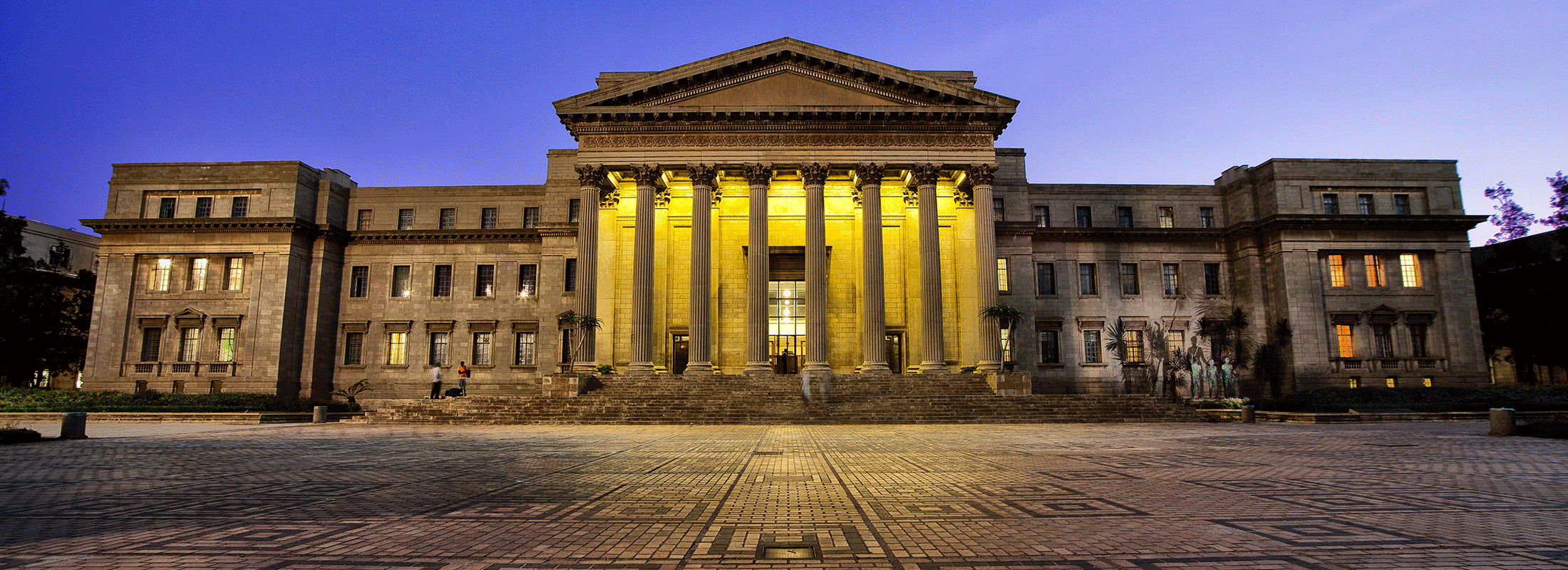 Lights on behind columns of Wits Great Hall image credit Peter Maher