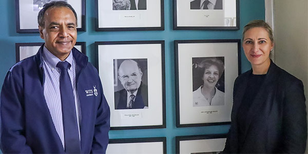 Pictured, standing with photographs of the late Philip Sceales and the late Janet Antrobus, are the Dean of Wits University’s Faculty of Health Sciences, Professor Shabir Madhi, and Assistant Dean of Research Professor Aletta Millen.